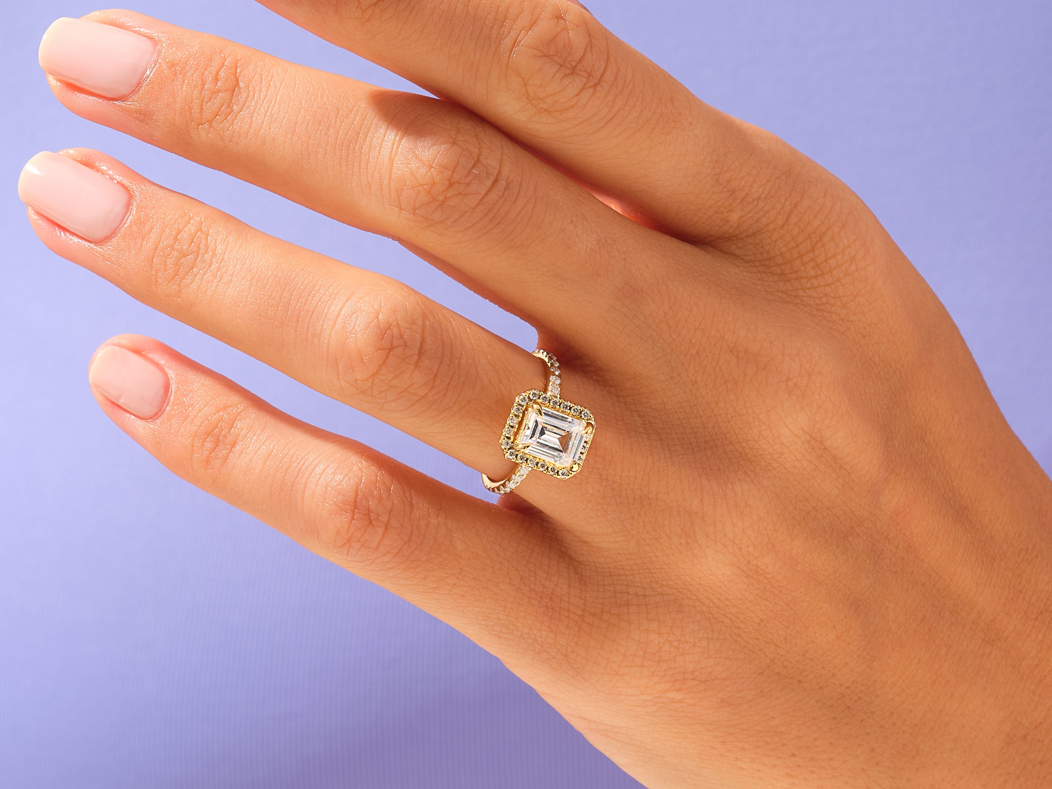 Emerald Halo Engagement Ring with Pave Set Side Stones