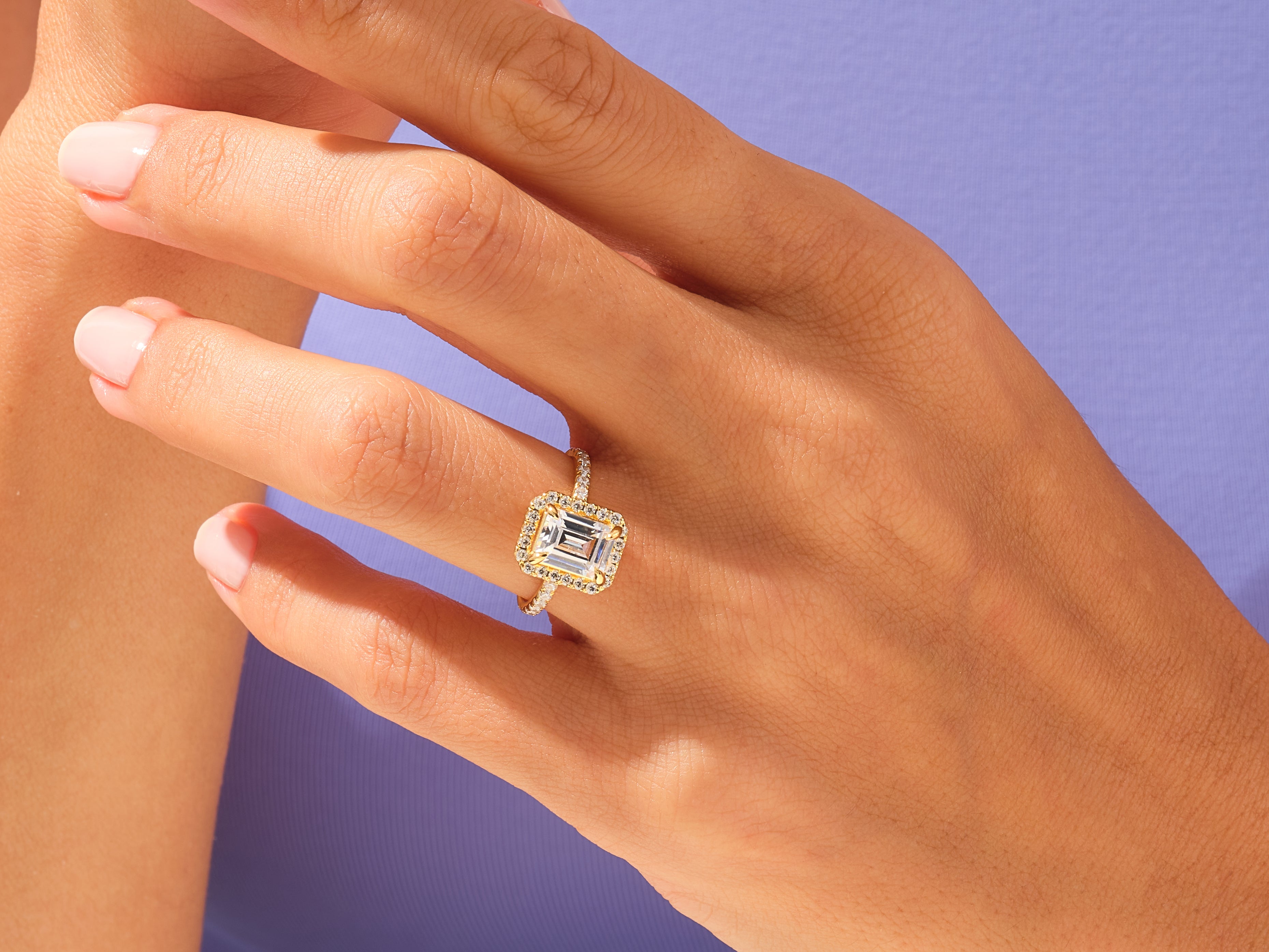 Emerald Halo Engagement Ring with Pave Set Side Stones