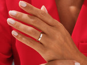 Elegant gold wedding band on a woman's hand, jewelry