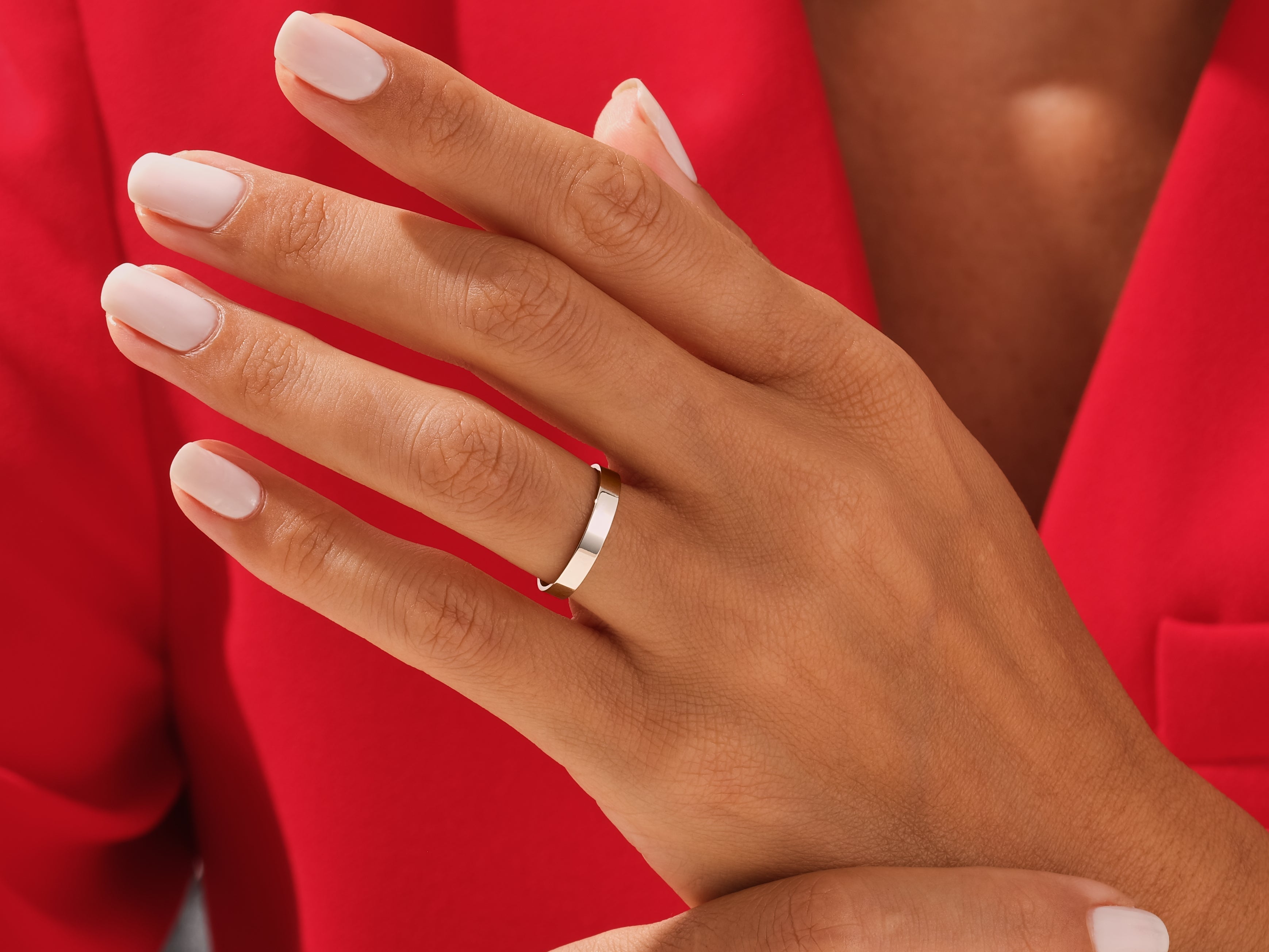 Elegant gold wedding band on a woman's hand, jewelry