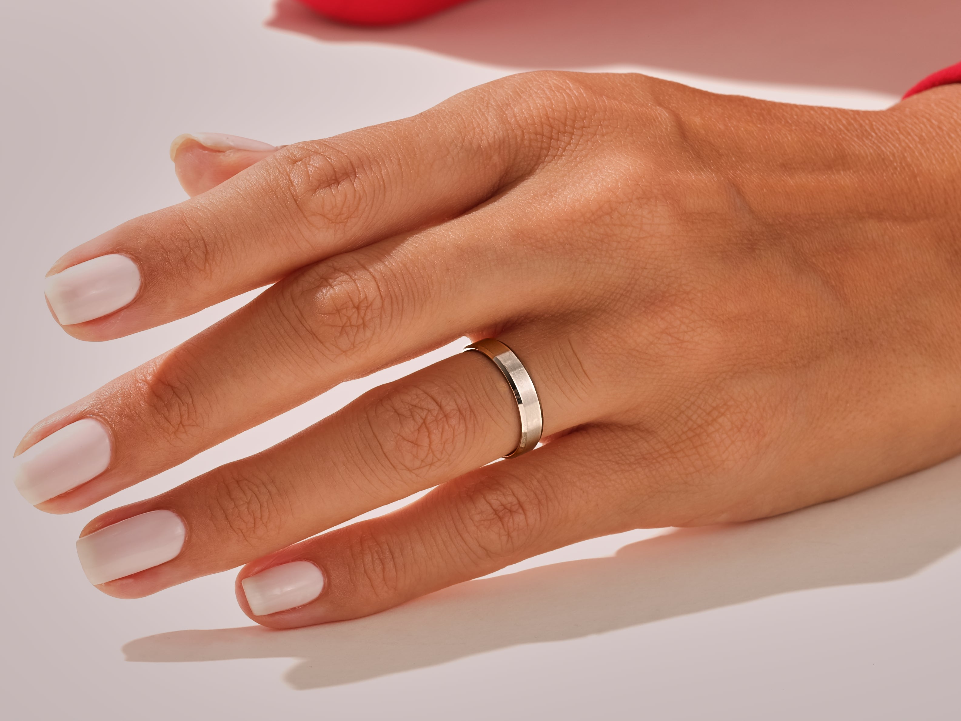 Elegant silver ring on a manicured hand, jewelry photography