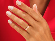 Rose gold ring on hand, elegant jewelry for women