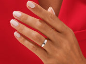 Elegant gold and silver band ring on a hand, jewelry product