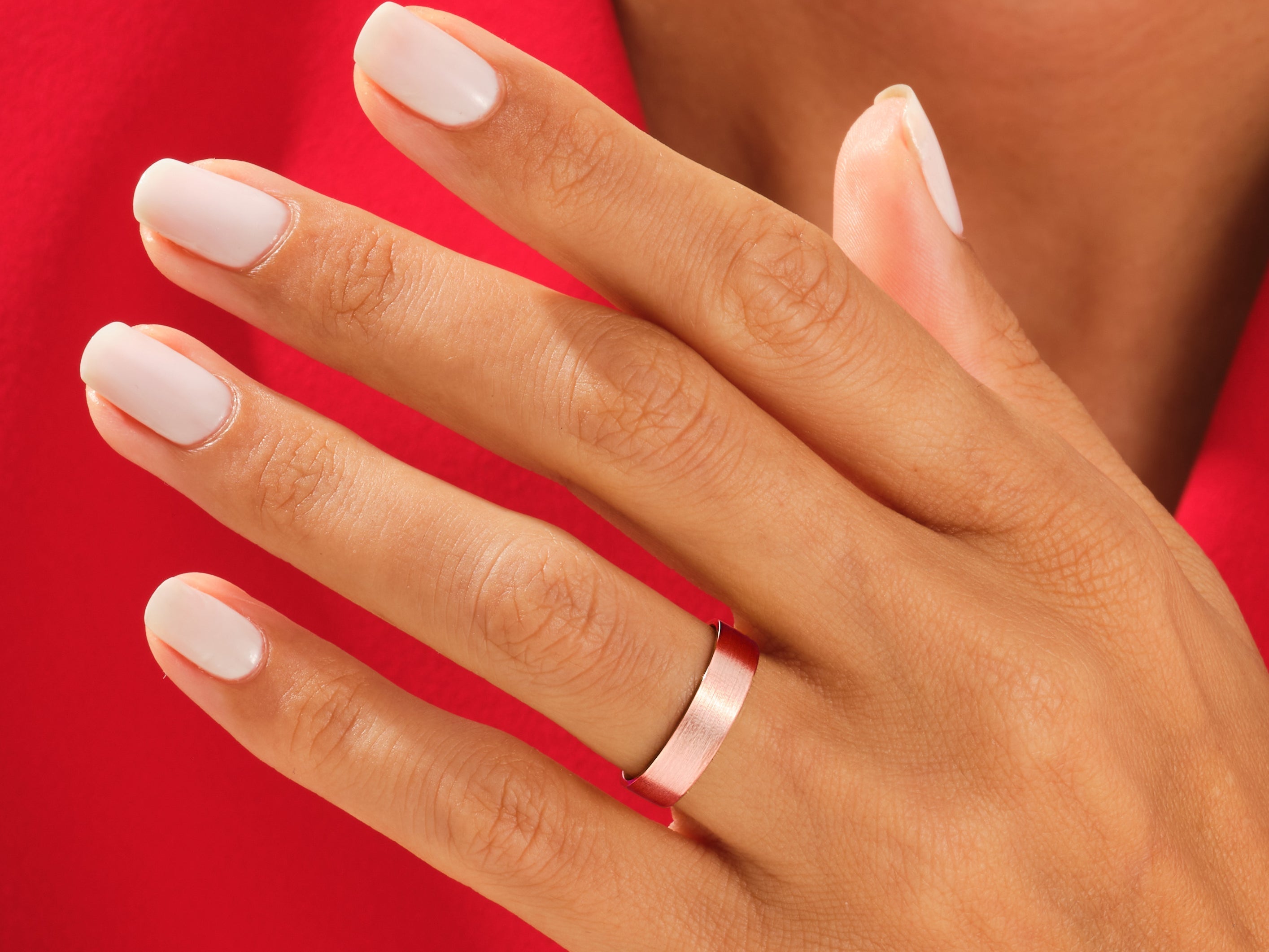 Rose gold ring on a hand, jewelry product photography