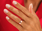 Rose gold ring on hand, elegant jewelry for women