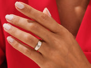 Elegant silver band ring on a hand, jewelry photography