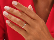 Elegant silver band ring on a hand, jewelry product photography