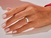Elegant silver ring on a hand with manicured nails