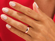 Rose gold ring on a hand with white nails, jewelry