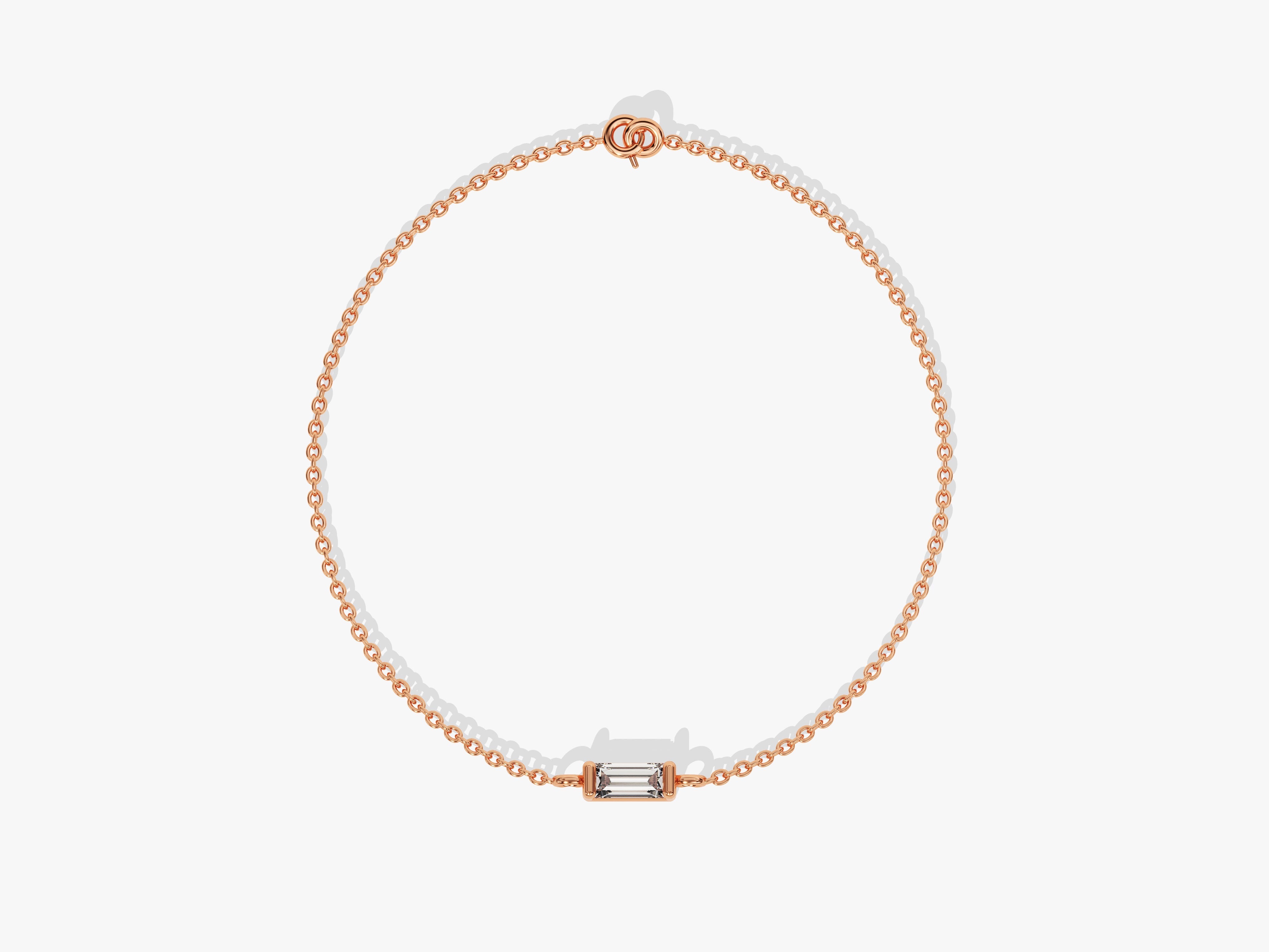 Rose gold chain bracelet with a single baguette diamond centerpiece