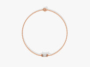 Rose gold chain bracelet with a single baguette diamond centerpiece