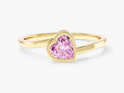 Gold ring with pink heart-shaped gemstone