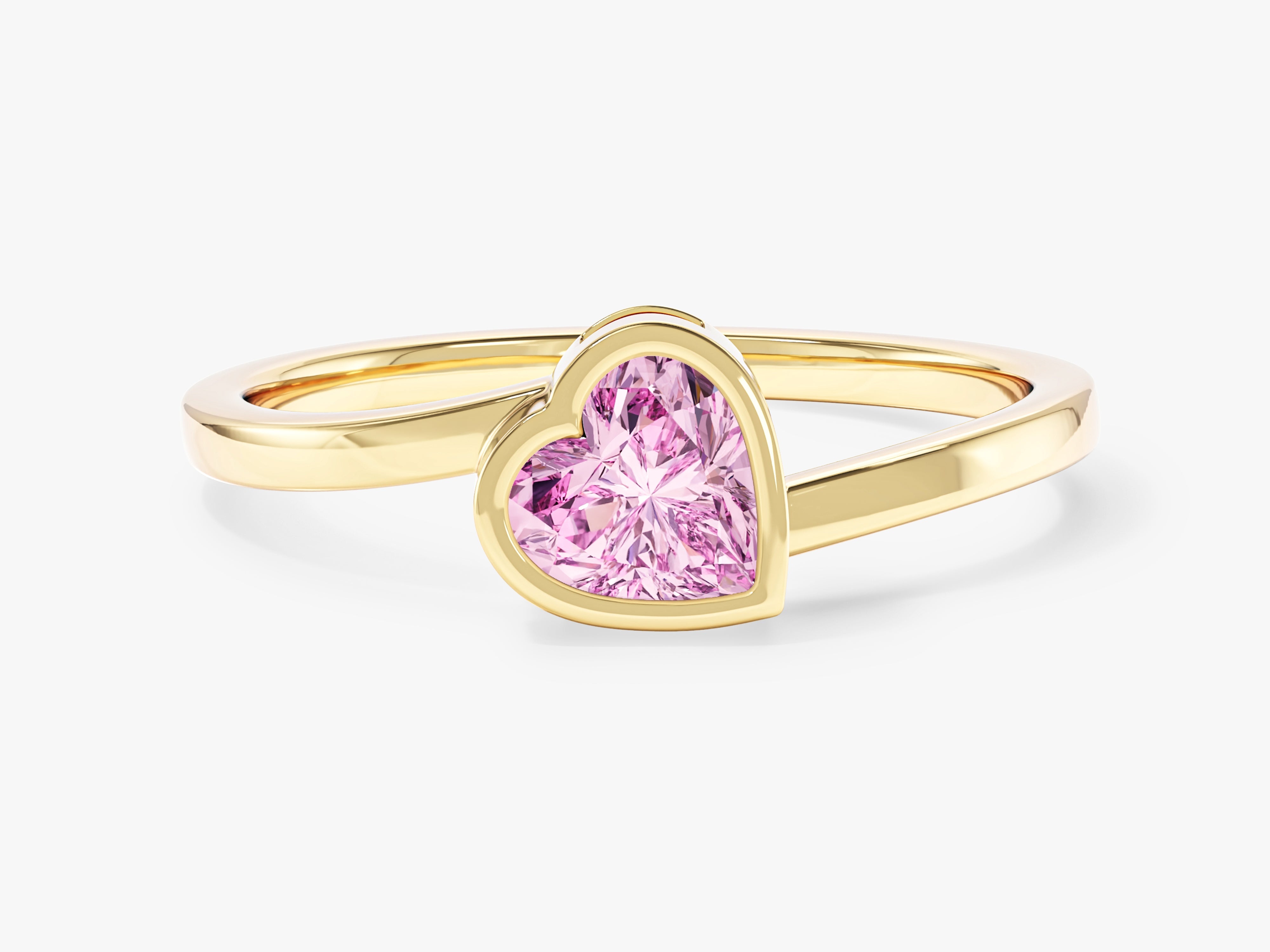 Gold ring with pink heart-shaped gemstone