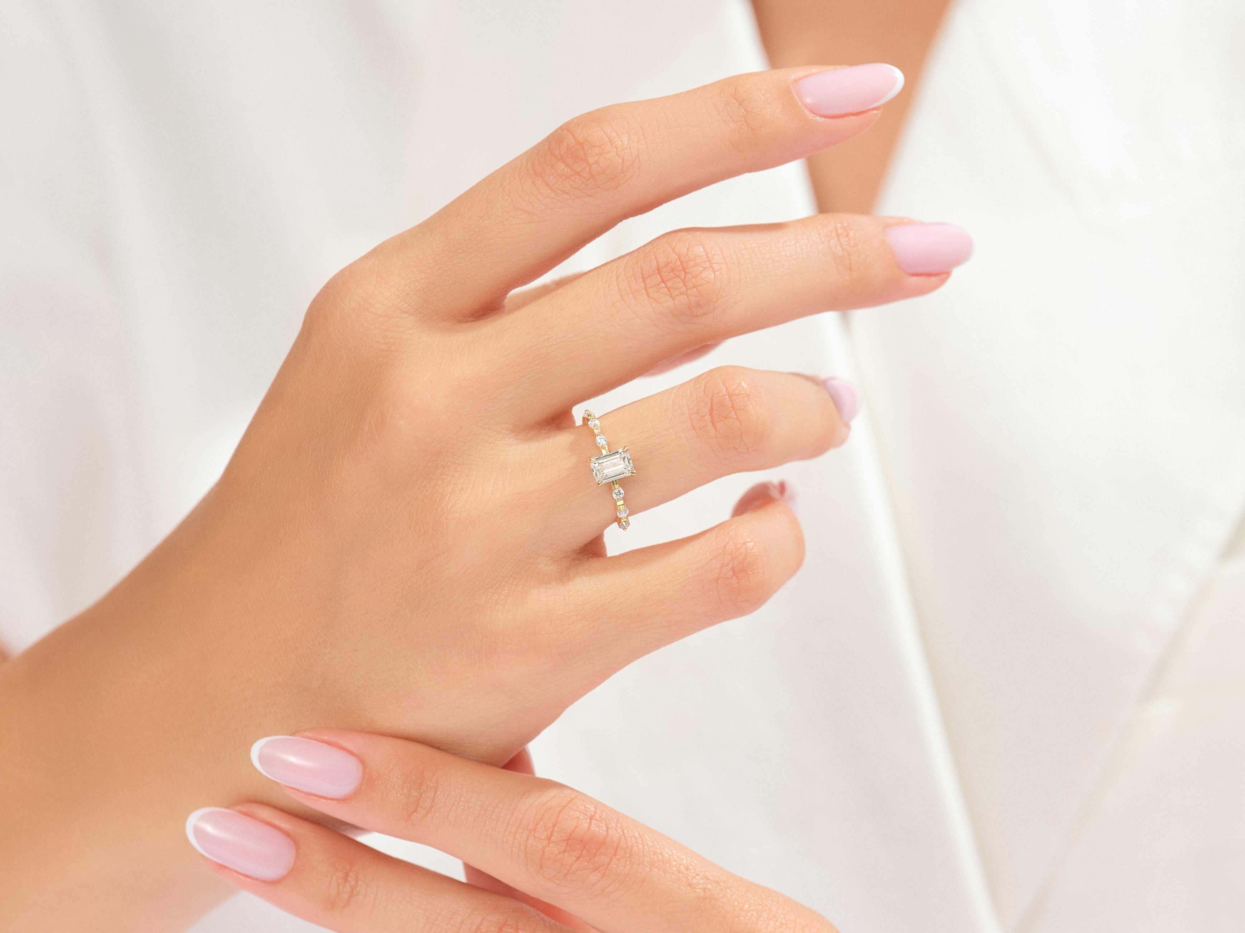 EG207_Model_Wearing_Emerald_Cut_Promise_Ring_3.jpg