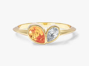 Gold ring with pear-shaped orange sapphire and diamond