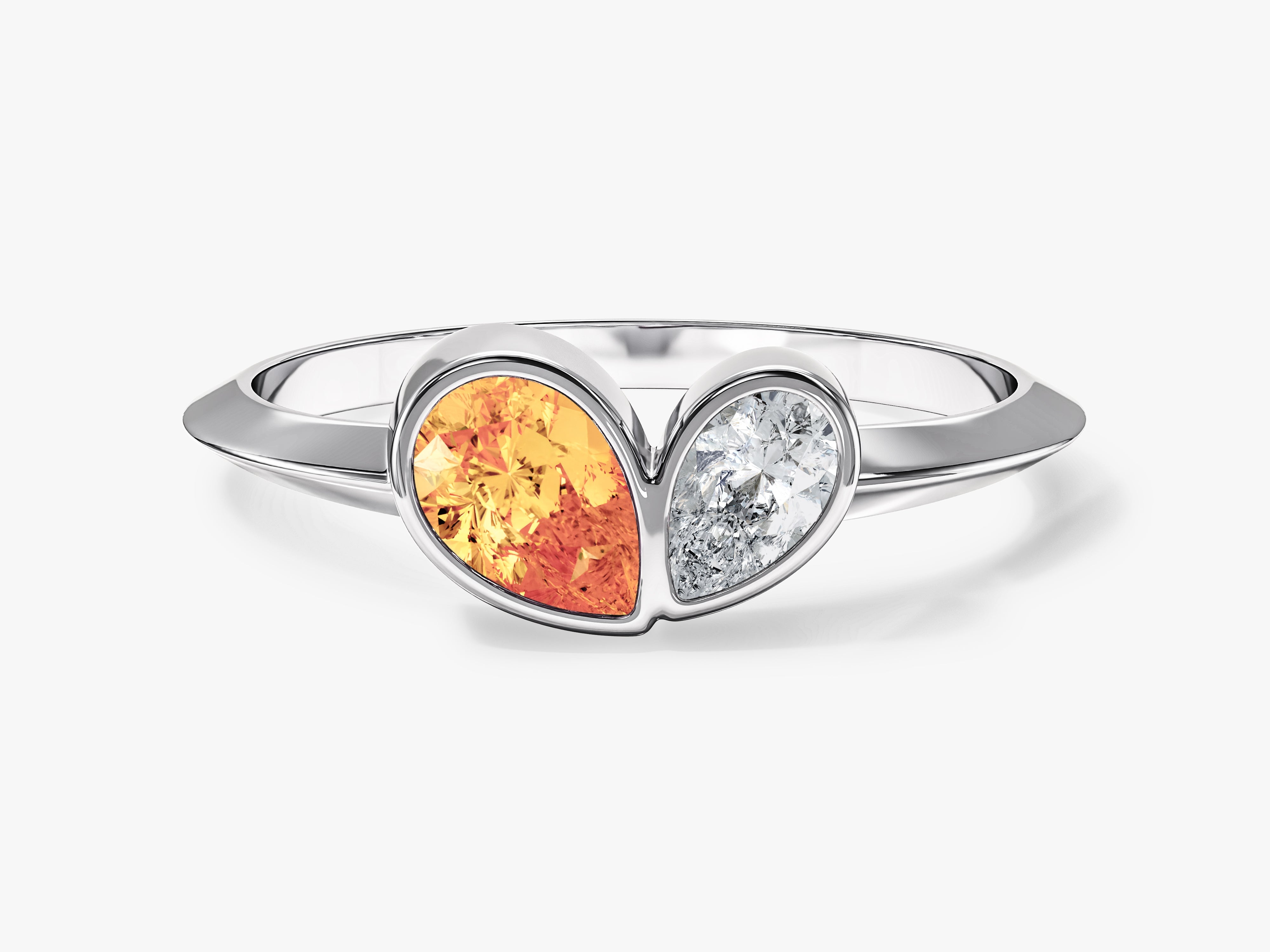 Silver ring with orange gemstone and diamond heart design