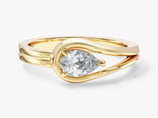 Gold ring with pear-shaped diamond engagement jewelry
