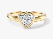 Gold ring with heart-shaped diamond engagement jewelry
