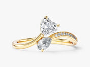 Gold ring with two diamonds, heart and pear shape, diamond band