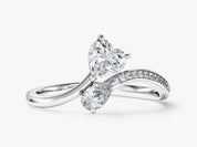 Diamond engagement ring with heart and pear shape stones
