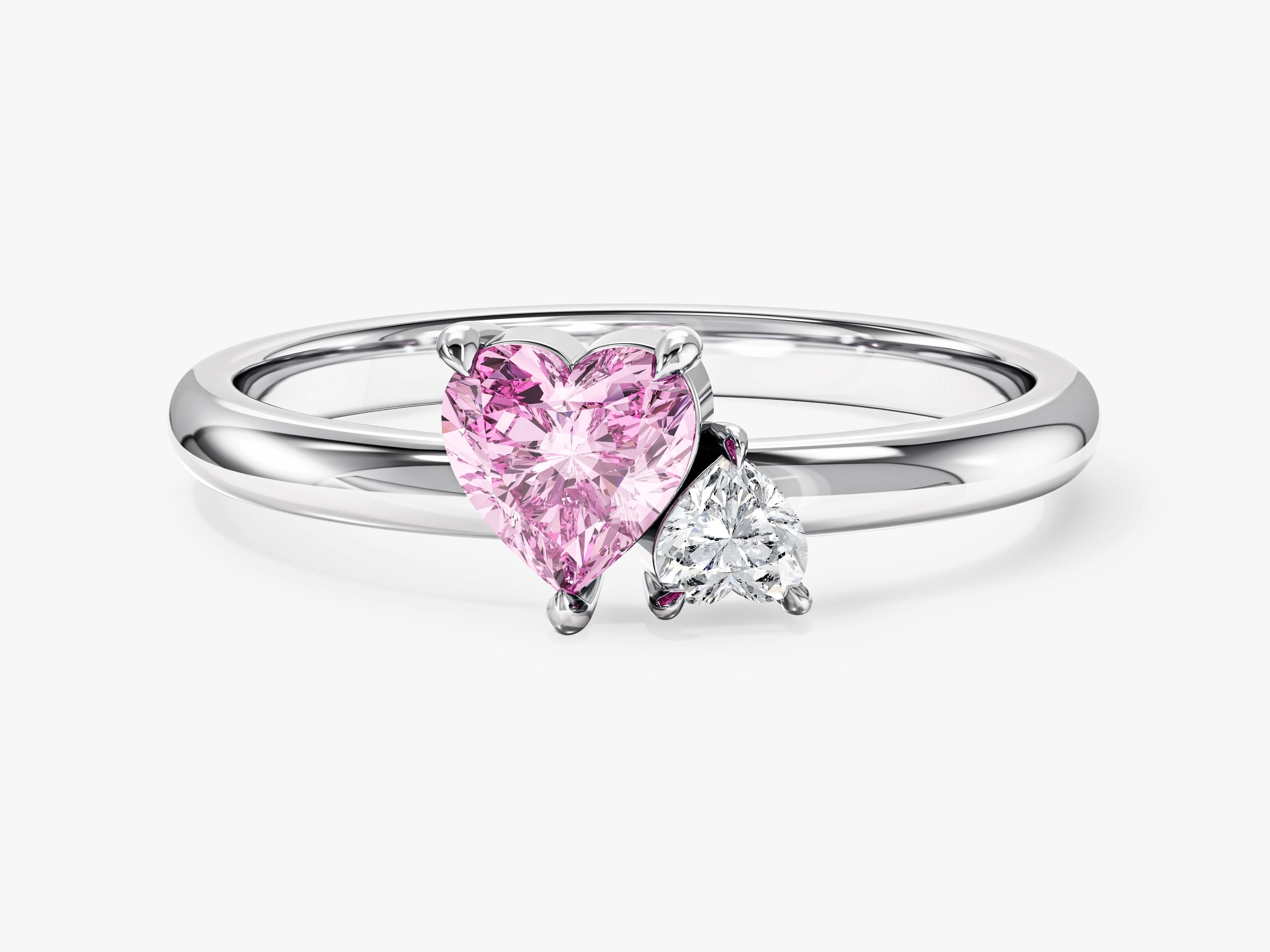 Heart-shaped pink diamond ring with a white diamond accent