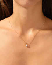 Diamond pendant necklace on a woman's neck, fine jewelry