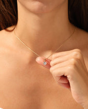Diamond solitaire necklace on a gold chain, jewelry