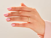 Diamond and gold ring on a hand, jewelry