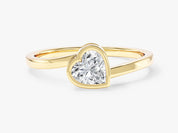 Gold ring with heart-shaped diamond engagement ring