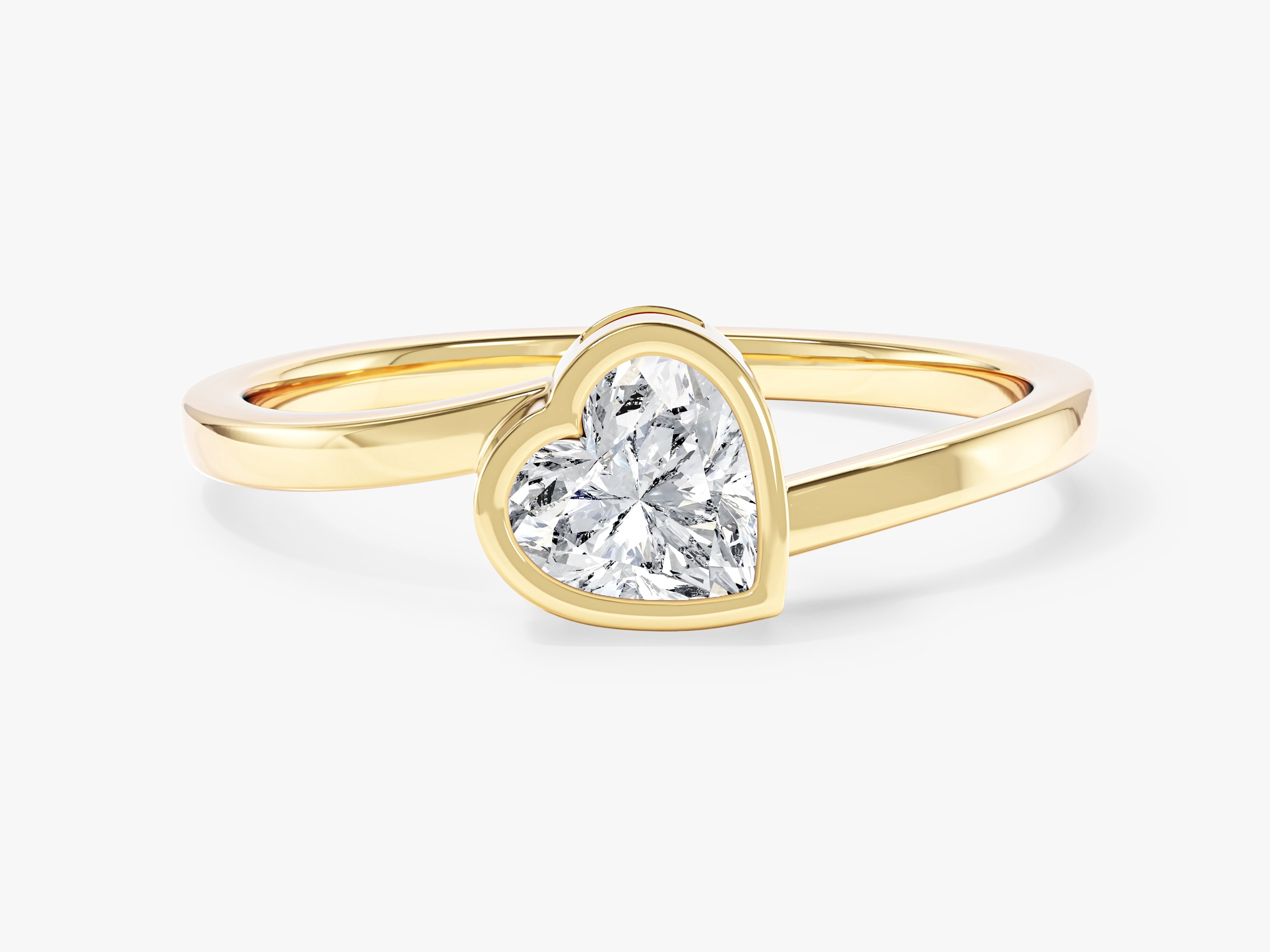 Gold ring with heart-shaped diamond engagement ring