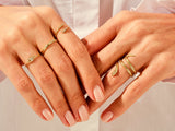 Yellow, White, Rose, 14k gold, 18k gold, 4 Different Designes of Fashion Rings on a Woman's Fingers