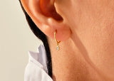 14k Gold, Yellow, White, Rose, 14k Minimalist Gold Huggie Earrings with Bezel Set Diamonds in a womans ear